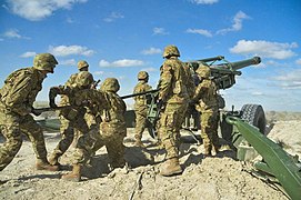 Argentine soldiers firing a CITER L33 155 mm howitzer