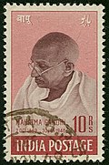 Pink-and-brown stamp with Gandhi's head and shoulders, facing left