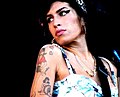 Image 123In 2008, Amy Winehouse tied the then record for the most wins by a female artist in a single night and became the first British woman to win five Grammys. (from 2000s in music)