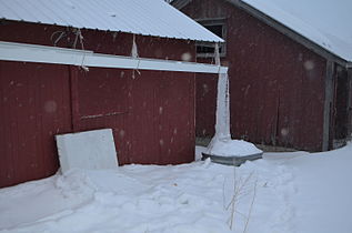 A very large icicle precipitated by gutter flow