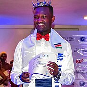 "The first winner of Mr. Autism Kenya, 2023." A slightly more historically significant event. Shows an autistic adult, who is not a celebrity, engaging in behavior directly related to autism (winning an award relating to being autistic).