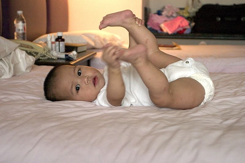 File:Baby holding feet.jpg