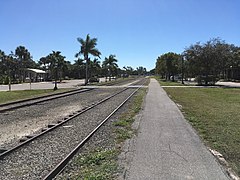 Seminole Gulf track though Downtown Bonita Springs. The platform is all that remains of the Atlantic Coast Line's passenger depot