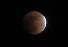 Eclipse observed from Victoria, British Columbia at 02:56 UTC, just prior to total. Lunar north is near top-left.