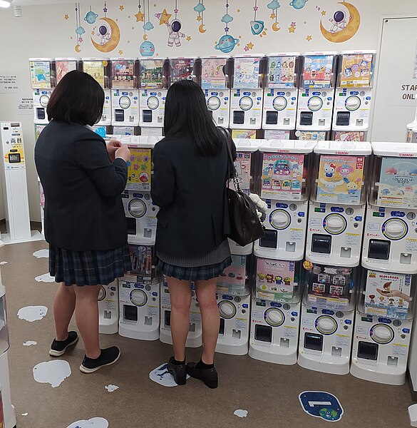 File:Japanese schoolgirls at gashapon.jpg