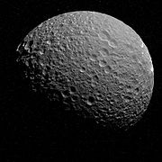 The 'reverse' side of Mimas, with fractures (chasmata) possibly caused by Herschel's creation.