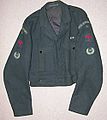 Typical 1950s style tunic showing black plastic ROC buttons, ROC shoulder flashes, No.6 Group numerals, Red "Spitfire" and Leading Observer rank badges. Also, an ROC Medal ribbon is worn on the tunic front.