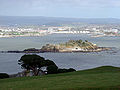 Image 43Northeastward view of Plymouth Sound from Mount Edgcumbe Country Park in Cornwall, with Drake's Island (centre) and, behind it from left to right, the Royal Citadel, the fuel tanks of Cattedown, and Mount Batten; in the background, the hills of Dartmoor. (from Plymouth)