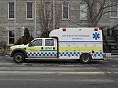 A paramedic truck in Montreal with Battenburg markings.