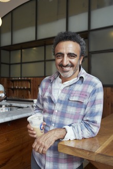 Hamdi Ulukaya drinking coffee.