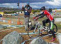 Image 5 Mountain bike trials Photo: Steve Bennett Joe Oakley (right), being penalised by the official (centre) for "dabbing" his foot on the ground during a mountain bike trials competition. Trials riding is a mountain biking discipline in which the rider attempts to pass through an obstacle course without setting foot to ground. Originating in Catalonia, it is popular within Europe and has a small following worldwide. More selected pictures