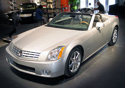 Cadillac XLR c. 2007, with fully retracted aluminum (i.e., lightweight) hardtop concealed by self-storing tonneau cover, the hardtop manufactured by a supplier joint venture of Mercedes-Benz and Porsche[29]