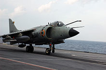 Jet aircraft on deck of aircraft carrier. Its refuelling receptacle is extended near the pilot's canopy