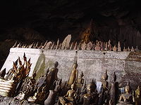 Buddha statues inside the lower cave of the Pak Ou caves, Laos