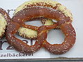 Typical Speyer pretzel on top of one covered with cheese