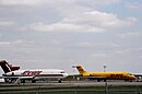 Apron VII with a Purolator Boeing 727 on the left, and a DHL MD-80 on the right.