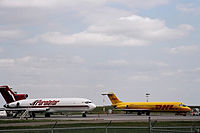 Apron VII with a Purolator Boeing 727 on the left, and a DHL MD-80 on the right.