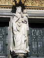 Statue of the Blessed Virgin Mary on the central jamb of the door.