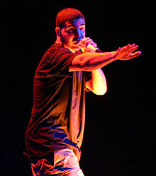 An image of Drake performing on stage.