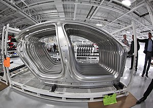 Stacked side panels that have been formed on the tandem press line.