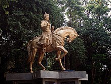 An outdoor statue of a man on a horse