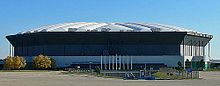 a colour photograph of a large domed stadium