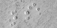 Close view of cones, as seen by HiRISE under HiWish program These cones probably formed when hot lava flowed over ice-rich ground. The location is the Elysium quadrangle.