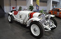 A 1928 Mercedes, white with red trim and a red interior