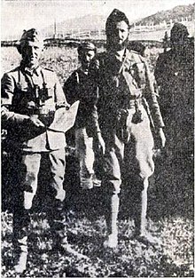 Black and white photograph of several men in uniform