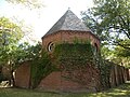 A castle-like wall around a parking area