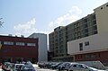 Partial view of the main multi-story building (under construction) and the new two-story building