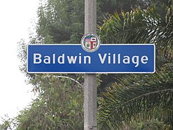 Street sign marking the border of the Baldwin Village neighborhood,located at the intersection of Rodeo Road and Martin Luther King Jr. Boulevard