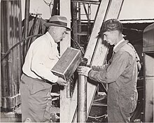 Pouring Nitroglycerin into oil well shooting torpedo.