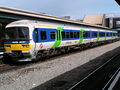 The old Thames Trains livery, with First Great Western Link logos added, remained until recently on this Class 166, seen here at Reading.