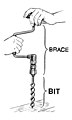 An auger bit in a brace for woodworking.