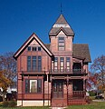 The Herman C. Timm House in New Holstein, Wisconsin, has stickwork painted in a darker brown for contrast.