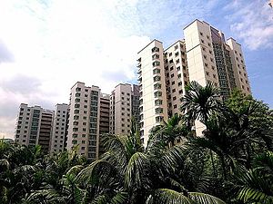 Apartment blocks laid out in a regular fashion on either side of a railway line