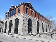 Exterior of a white and brown brick building