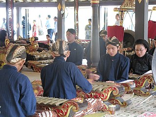 Five men playing percussion instruments