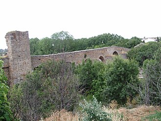 The ruins of the medieval bridge which gave the place its name