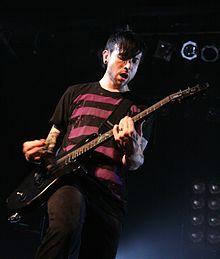 Martin performing with Good Charlotte in 2008