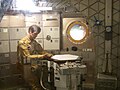 An astronaut mannequin dines aboard the backup Skylab at the Smithsonian NASM.