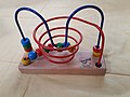 Image 28A bead maze (from List of wooden toys)