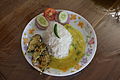 Dal bhat served with eggplant dish and salad