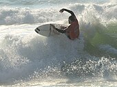 A surfer at Soorts-Hossegor, considered as one of the best surfing spots in the world.[132]