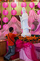 Devotee praying in the temple.