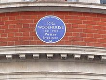 round blue plaque marking Wodehouse's residence, reading: P. G. Wodehouse, 1881–1975: Writer, lived here