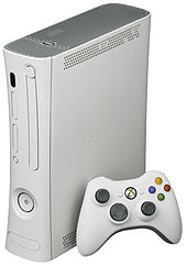 Xbox 360 Arcade console with white wireless controller.