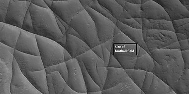 Close view of network of ridges, as seen by HiRISE under HiWish program. This is an enlargement of a previous image. Box shows the size of a football field.