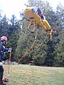 The carriage system that suspends the rescuer underneath the helicopter.